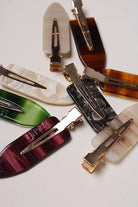 Barrettes maquillage ébène écaille et coloris variés – accessoires cheveux femme